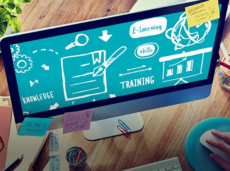 desktop monitor showing training and learning icons